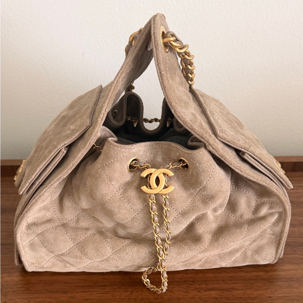 Chanel 25 Small in Grey Suede. Less than one year old.